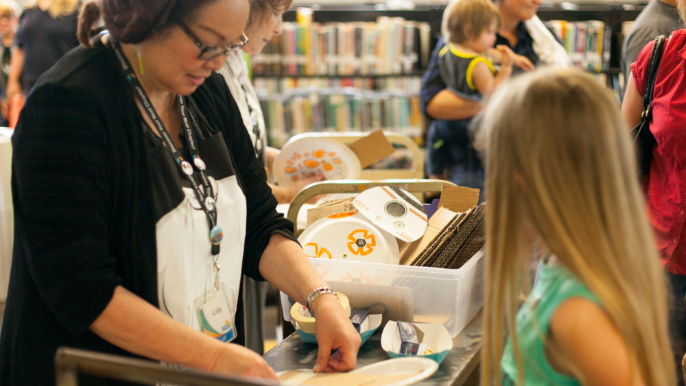 Library staff and children