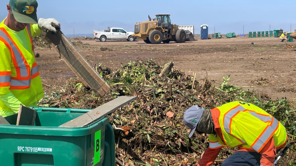 Two staff members cleaning up at Miramar Greenery