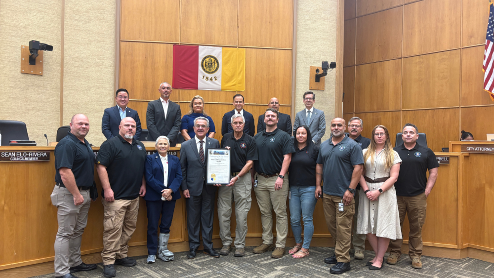 Group picture of Office of Emergency Services employees at City Council
