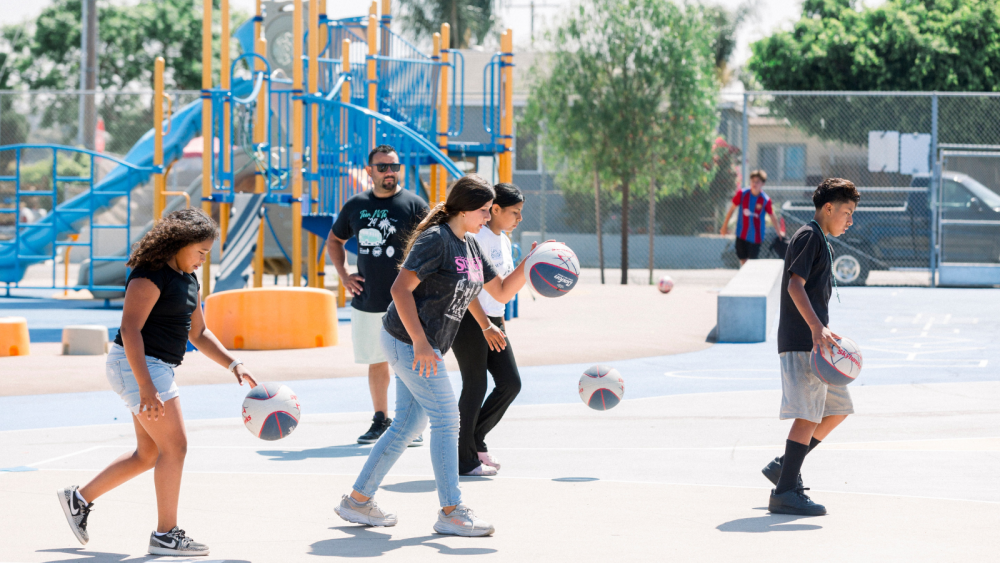 Photo of children playing basketball