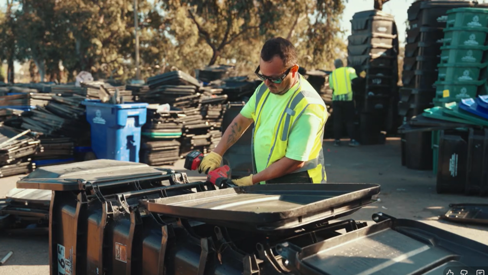 Photo of staff disassembling bins 