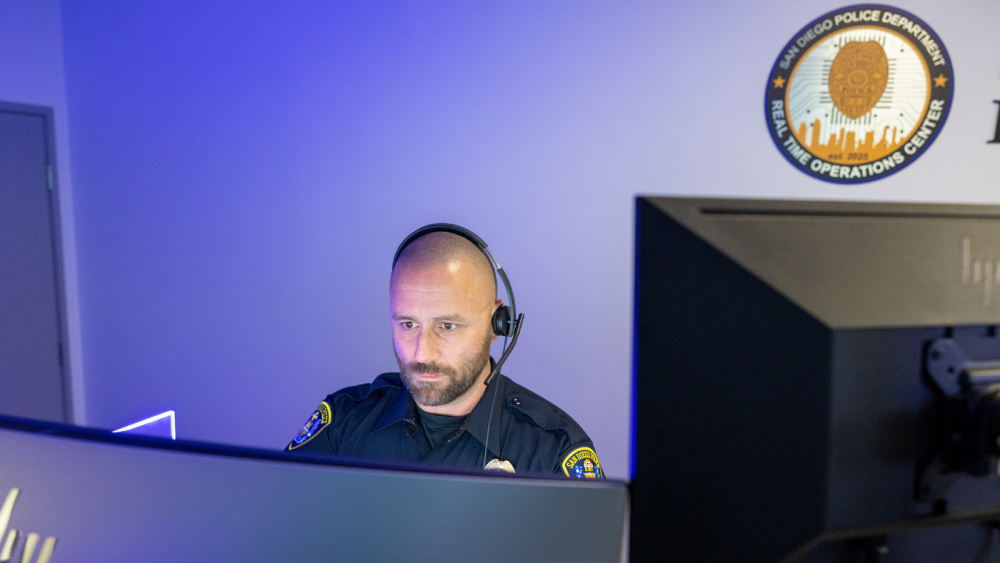 Photo of police officer at computer