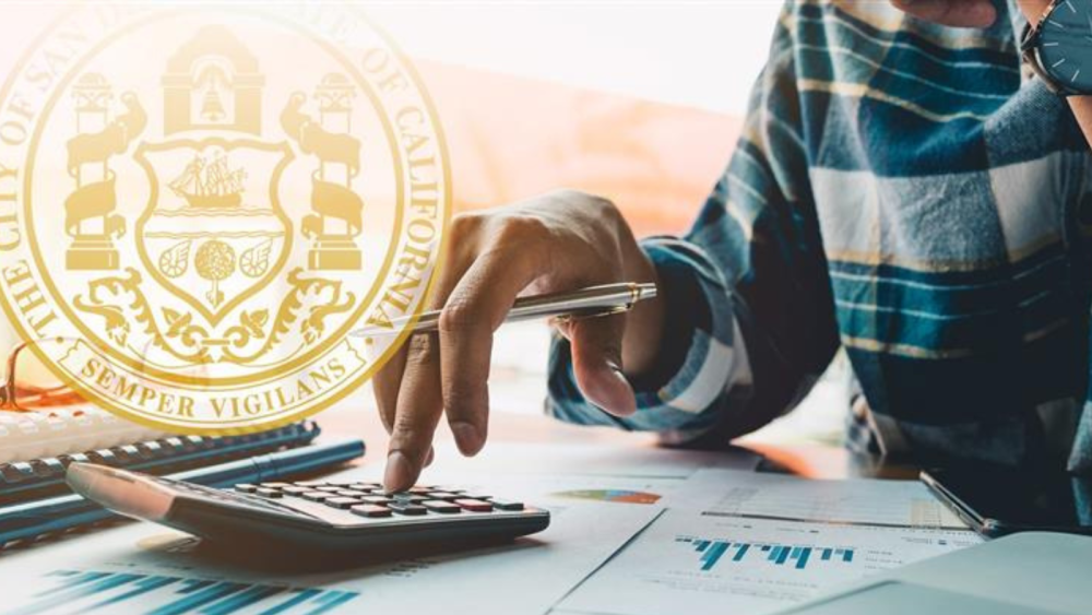 Photo of City seal and a person in the background using a calculator