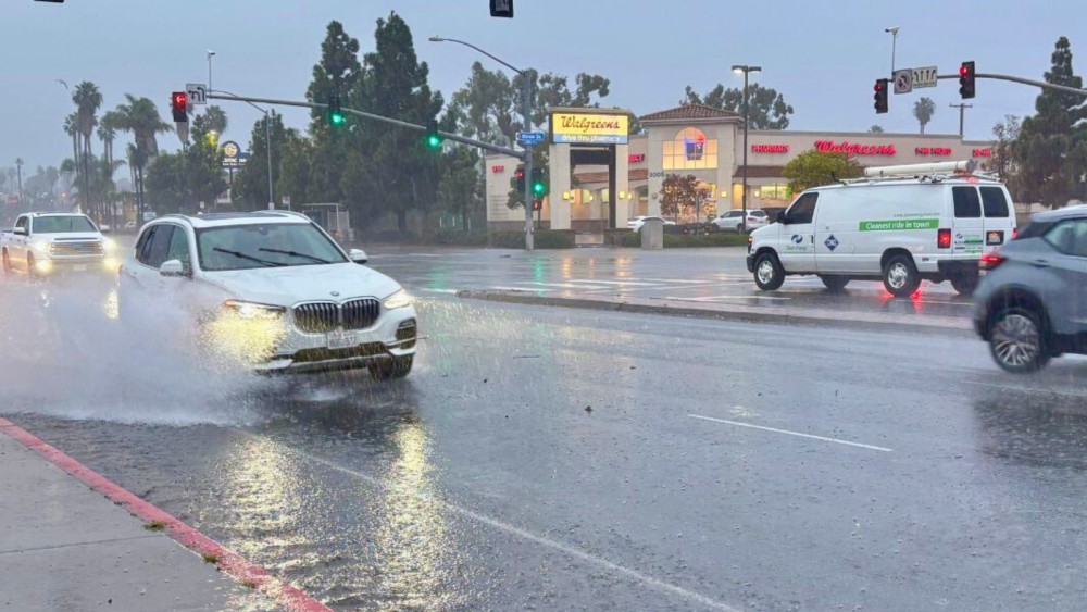 Photo of cars driving in the rain