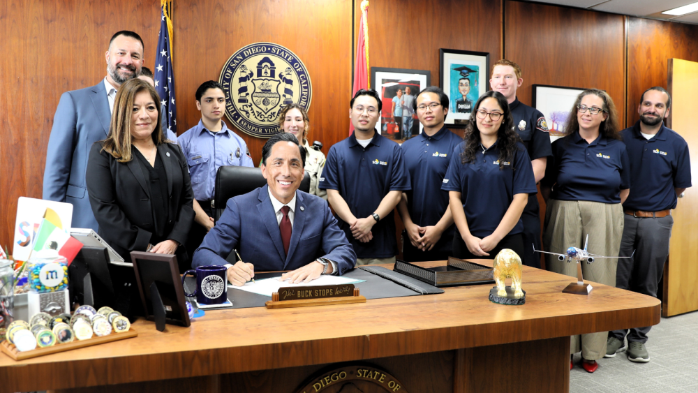 Photo of Mayor after he signed resolution