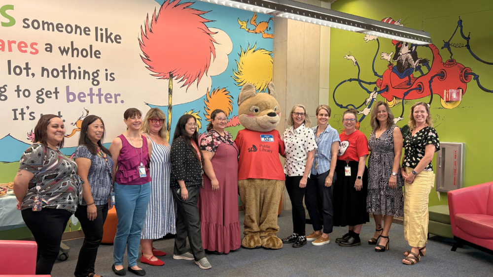 Library staff and Odi taking group picture