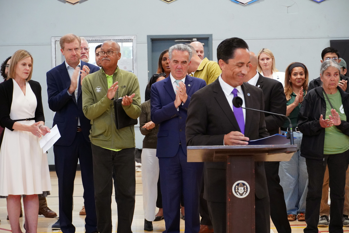 Mayor smiling while giving remarks