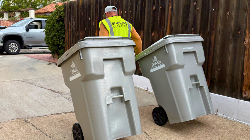 New gray trash bins being delivered